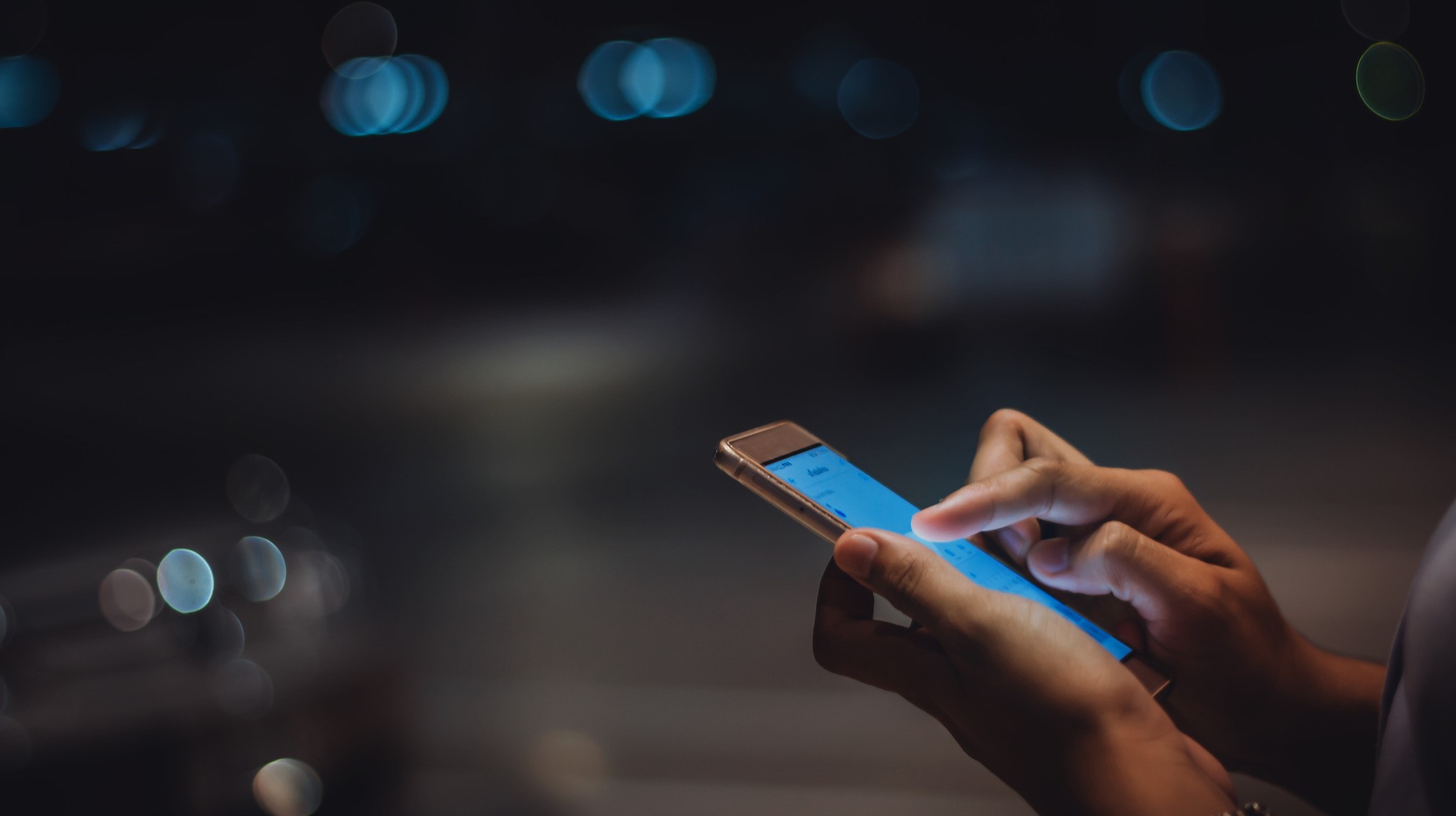a women holding a mobile phone