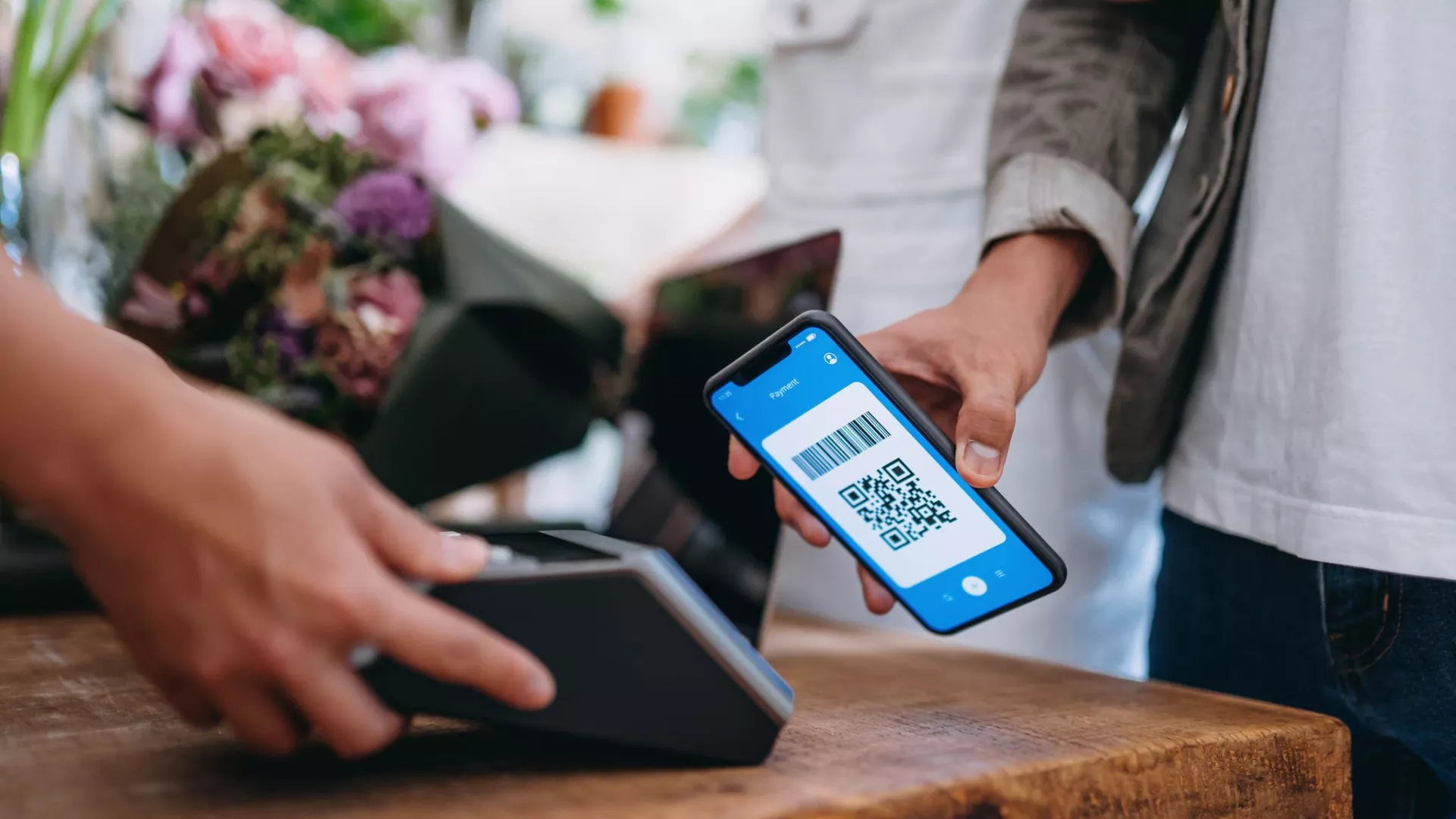 a man is paying with qr code