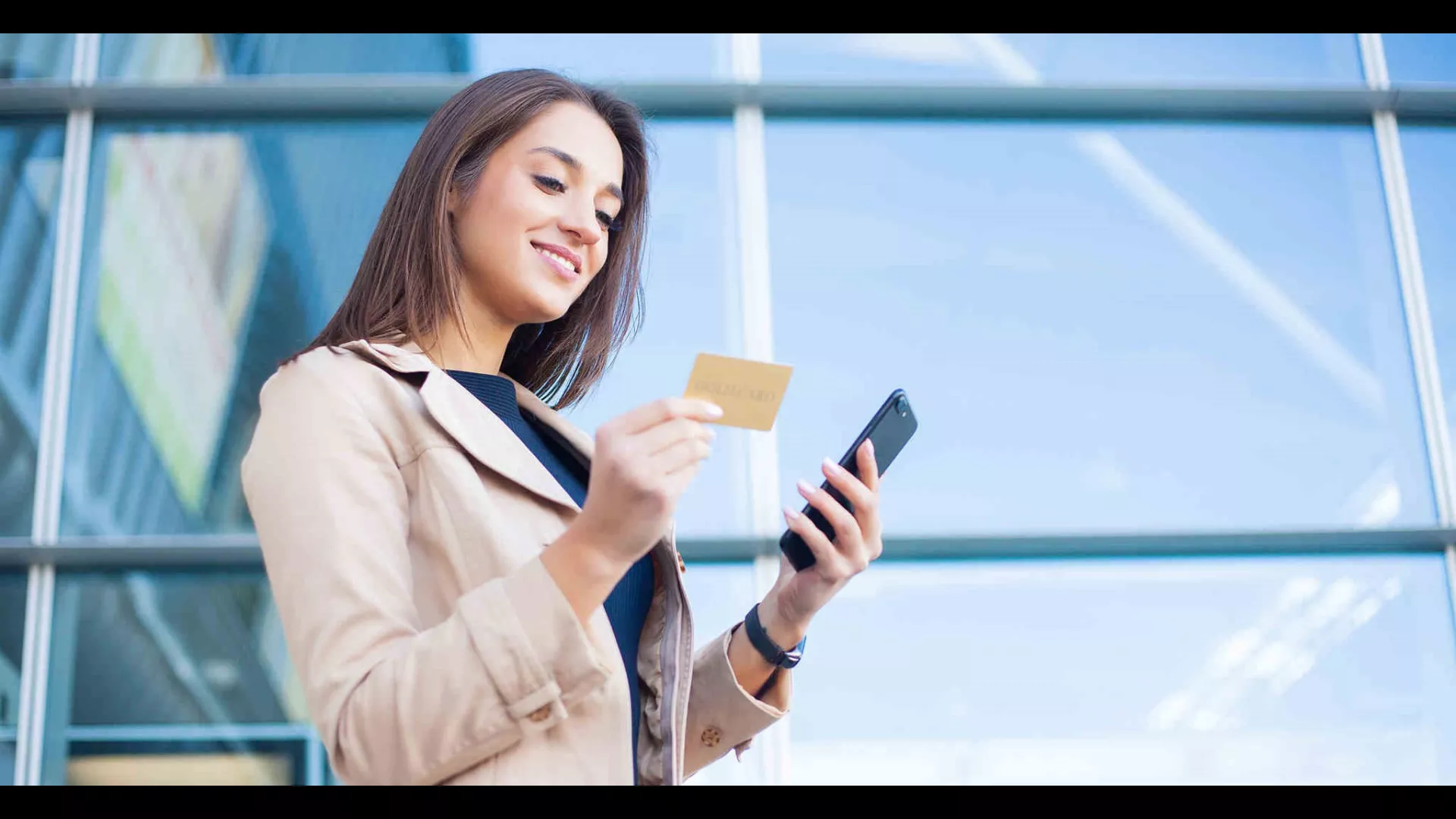 women looking at a credit card