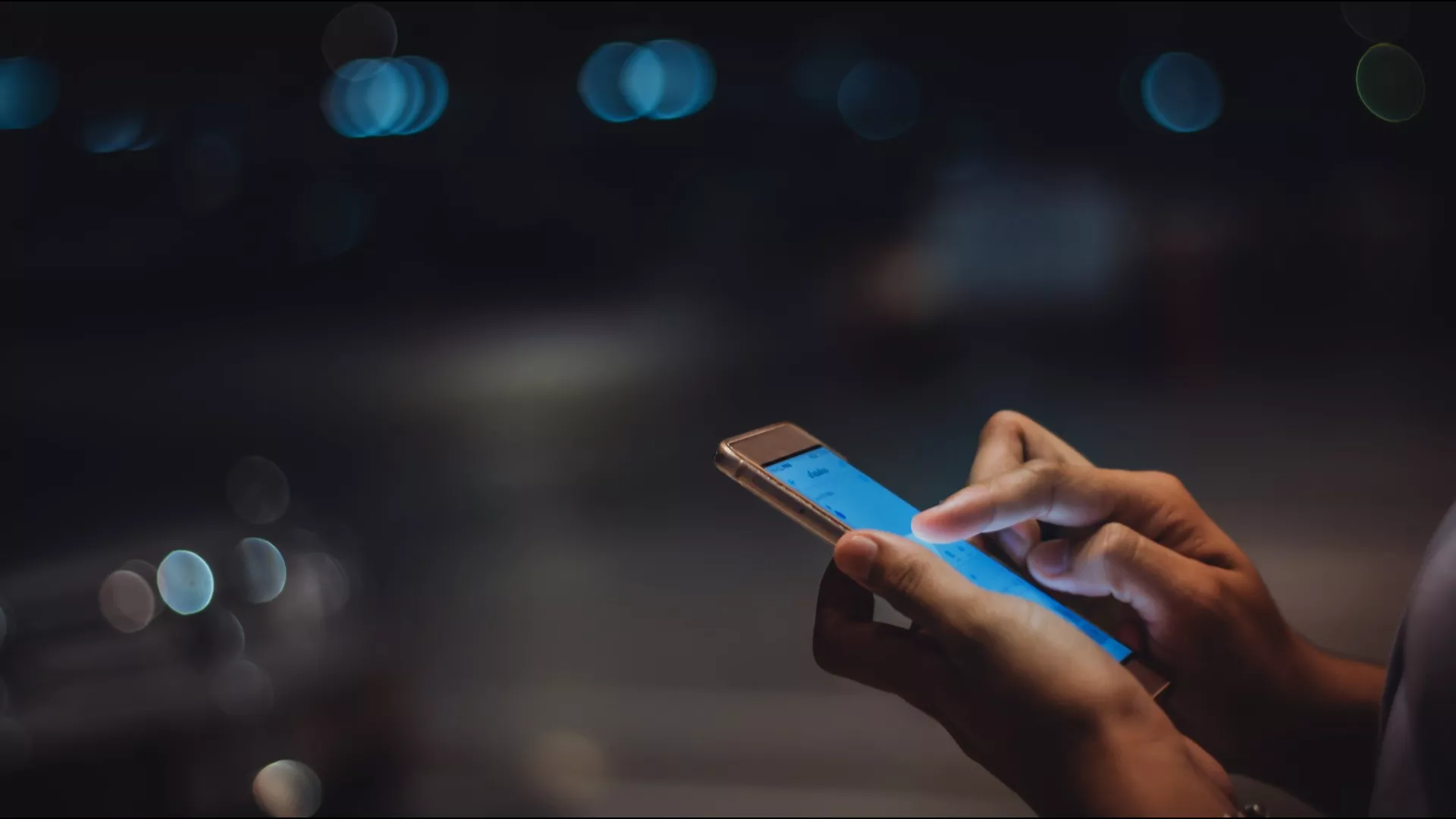 a women holding a mobile phone